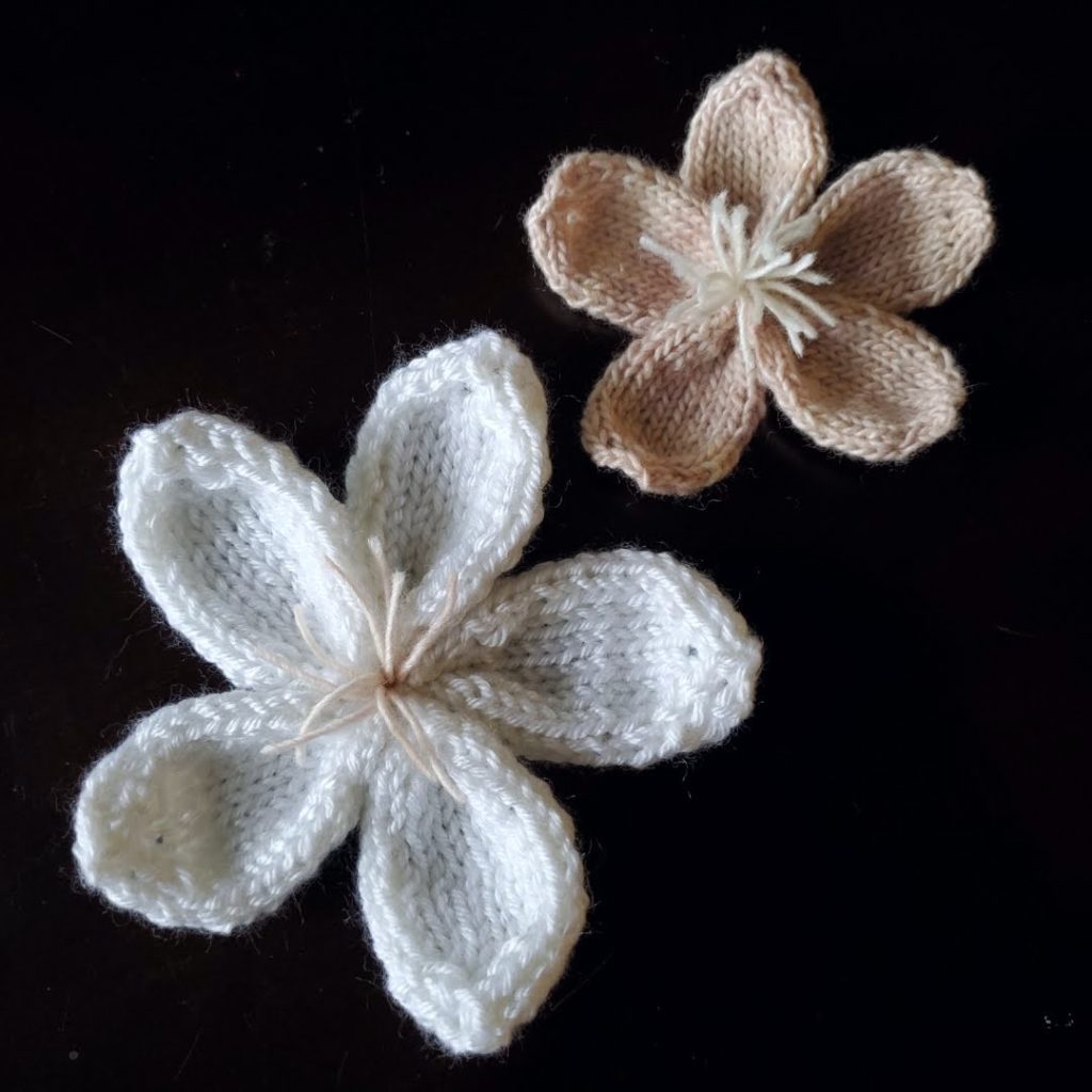 Knitted Cherry Blossoms pattern dark bg