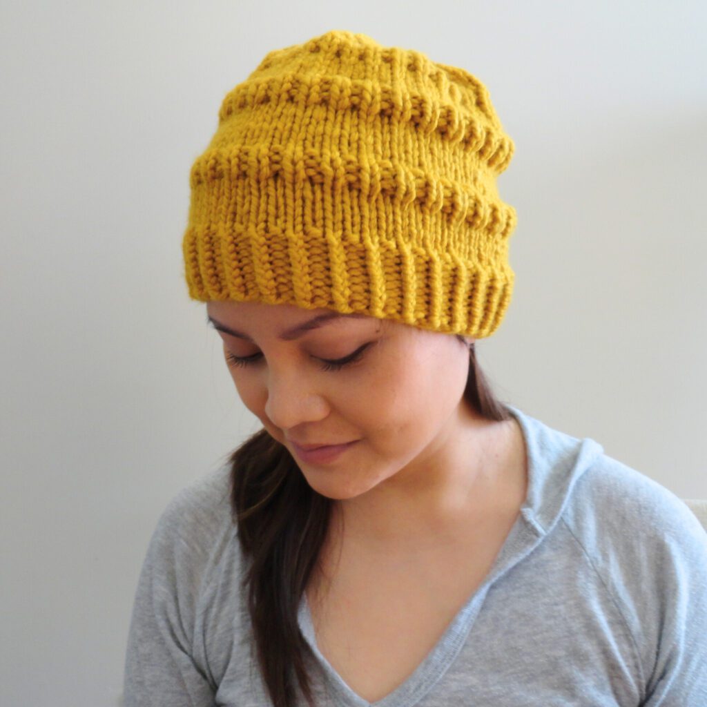 Knitted Ribbed Beanie for Charity Side View 2